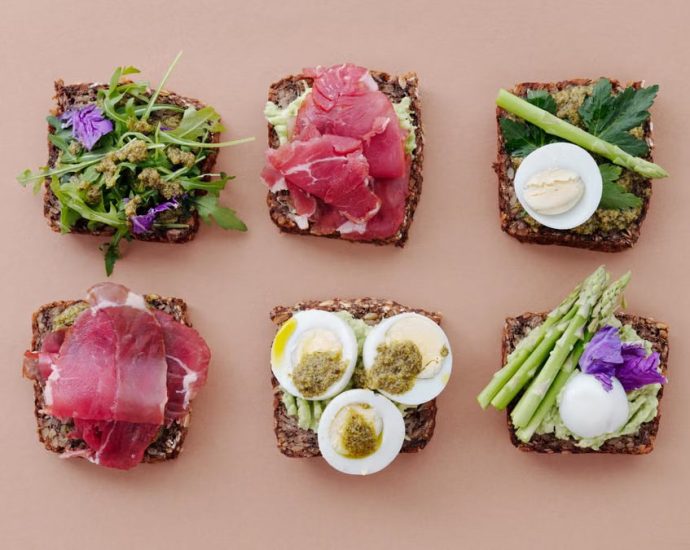 A top view of gourmet sandwiches with fresh ingredients presented in a flat lay style.